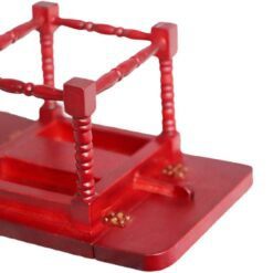 Miniature wooden dining table with intricate design for dollhouses.