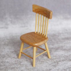 Miniature dining table with 4 chairs, perfect for dollhouse living spaces.