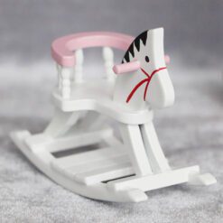 Miniature wooden rocking horse with blue detailing for dollhouse nurseries.