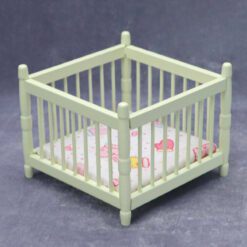 Miniature nursery furniture set including crib, cradle, high chair, and more.