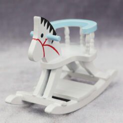 Miniature wooden rocking horse with blue detailing for dollhouse nurseries.
