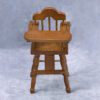 Miniature wooden baby high chair for dollhouses.
