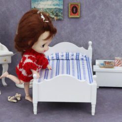 Miniature single wooden bed with floral bedding for dollhouse