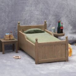 Miniature wooden bed with green bedding for dollhouse